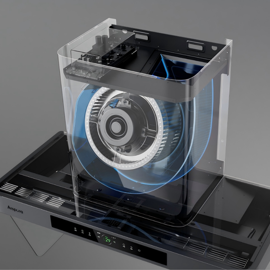 Transparent cutaway view of a range hood revealing a large centrifugal blower wheel with blue circular airflow paths, illustrating filter-free grease separation technology