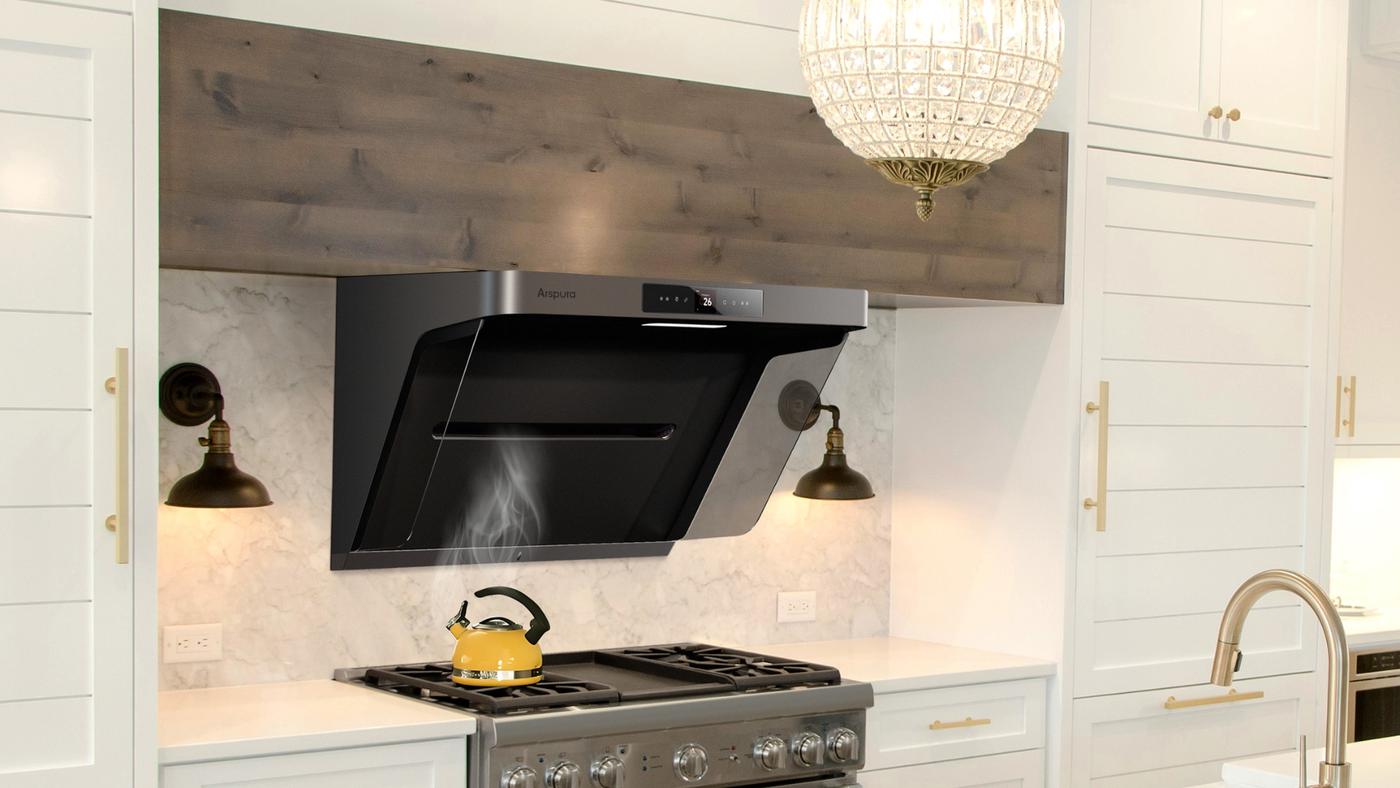 Farmhouse white kitchen with black angled range hood, shiplap walls, marble backsplash, and crystal pendant light fixture