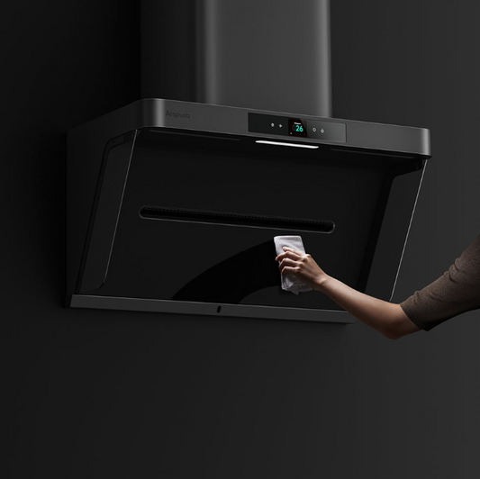 Close-up of Arspura wall-mounted range hood with sleek black angled glass panel and stainless steel top, showing modern minimalist design with digital control panel